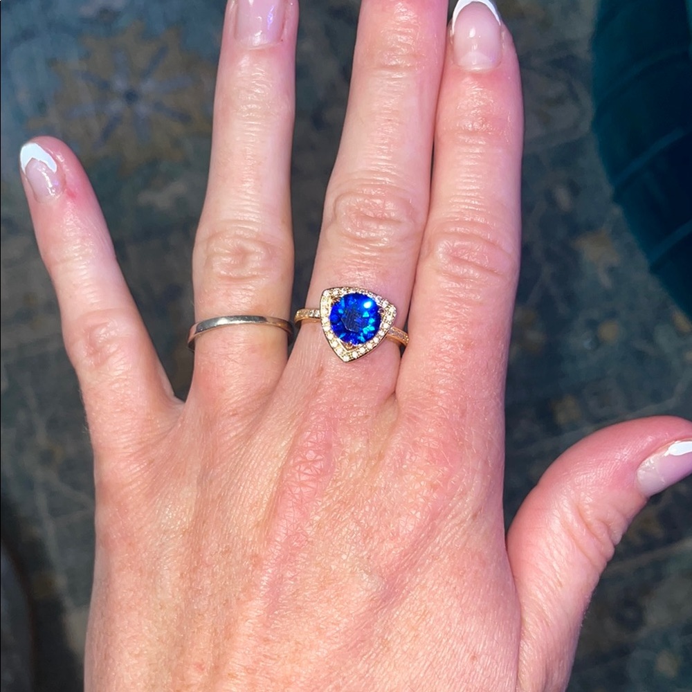 Gold ring with blue center stone